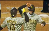  ?? GENE J. PUSKAR — THE ASSOCIATED PRESS ?? San Diego’s Wil Myers, right, celebrates with Manny Machado as they head back to the dugout after scoring on Myers’ two-run homer.