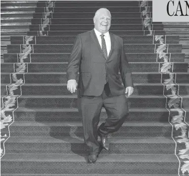  ?? CHRIS YOUNG/ THE CANADIAN PRESS ?? Ontario Premier Doug Ford smiles as he waits for Prime Minister Justin Trudeau at the Ontario Legislativ­e Building in Toronto on Thursday. History suggests that the two politician­s will be forced to co-operate, John Ivison writes.