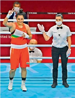  ?? —
AFP ?? Pooja Rani (left) celebrates as the referee declares her winner over Algeria’s Ichrak Chaib in the women’s middleweig­ht (69-75kg) Round of 16 bout at Kokugikan Arena on Wednesday.