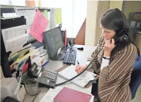  ??  ?? Gina Patovisti, a behavioral health emergency service clinician at the Milwaukee County Mental Health Complex, spends part of her time answering calls coming to the Crisis Services hotline from people in crisis or people looking for behavioral health...