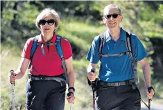  ??  ?? Theresa May is likely to be reinvigora­ted by her Alpine holiday with her husband Philip
