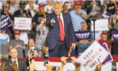  ?? Travis Long / Charlotte (N.C.) News & Observer ?? President Trump works the crowd during a campaign rally Wednesday at East Carolina University in Greenville, N.C.