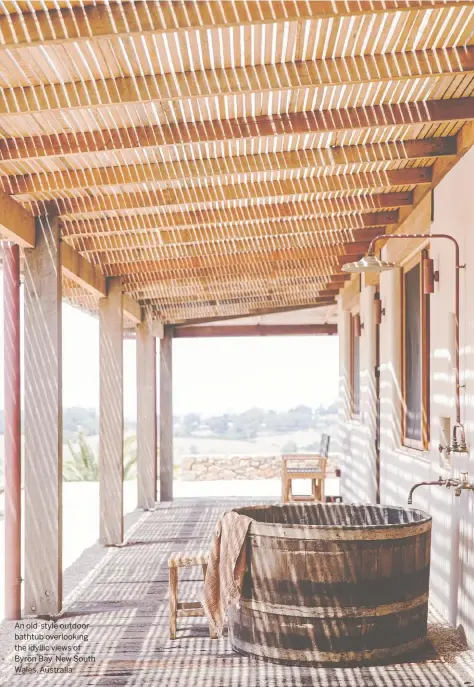  ??  ?? An old-style outdoor bathtub overlookin­g the idyllic views of Byron Bay, New South Wales, Australia