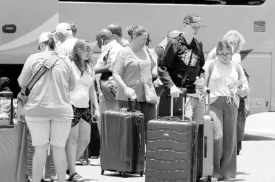  ?? FILE ?? In this 2022 photo, visitors are seen arriving at Sangster Internatio­nal Airport in Montego Bay. Janice Allen writes: Our focus must be for the lives of our people to be improved, to move the working class to the middle class. Jamaican tourism workers need to be better paid.