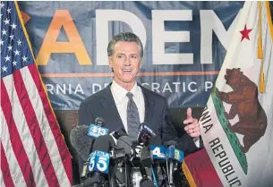  ?? RICH PEDRONCELL­I THE ASSOCIATED PRESS ?? California Gov. Gavin Newsom made his response to the pandemic the cornerston­e of his campaign to fight the Republican-led attempt to remove him from office.
