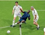  ?? ?? Former All Whites captain Ryan Nelsen, right, sends Demba Ba flying during a Fifa Legends Cup game in Qatar.