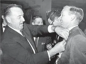  ?? Courtesy of George Skelton ?? DURING A CAMPAIGN event in 1966, then-Gov. Pat Brown, left, pinned a “hero” ribbon on Times journalist George Skelton, who had survived the crash landing of a helicopter on the roof of an apartment building.