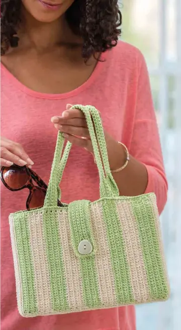  ??  ?? Fairly new to crochet? Learn the most basic stitch and you are ready to make this summery purse! Worked entirely in single crochet stitches, this classic design will work just as well in wool or acrylic yarn for a winter version!