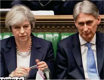  ??  ?? Tension: Theresa May and Philip Hammond in the Commons