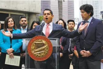  ?? Damian Dovarganes / Associated Press ?? California Assembly member Miguel Santiago, D-Los Angeles (center), moved to remove provisions from a net neutrality bill introduced by state Sen. Scott Wiener, D-San Francisco.