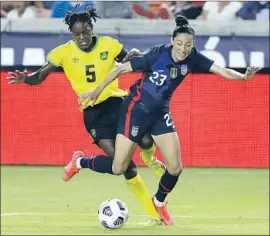  ?? Michael Wyke Associated Press ?? USA FORWARD Christen Press, battling during last month’s 2021 WNT Summer Series in Houston, has been directly involved in 37 goals in her last 37 games.