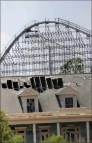  ?? GERALD HERBERT - ASSOCIATED PRES ?? In this June 19, 2019photo, the roller coaster and concession buildings of the abandoned Six Flags Great Adventure Amusement Park are seen in New Orleans.