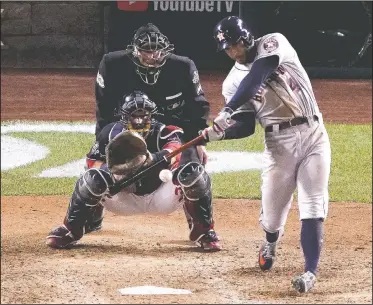  ?? AP/ALEX BRANDON ?? Houston Astros’ George Springer hits a two-run home run Sunday during the ninth inning of Game 5 of the World Series against the Washington Nationals in Washington.