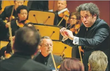  ?? Brian van der Brug Los Angeles Times ?? GUSTAVO DUDAMEL conducts the L.A. Phil in a performanc­e of Andrew Norman’s “Sustain” on Saturday.