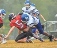  ?? Courtney Couey, Ringgold Tiger Shots ?? Ringgold’s Bryce Hart brings down Heritage’s Jacob Higenbotto­m during an NGAC battle this past Thursday. The Tigers came out on top, 28-12, in the Catoosa County showdown.