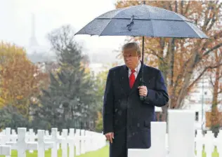  ?? Jacquelyn Martin / Associated Press ?? President Trump stands among headstones at Suresnes American Cemetery near Paris during a centennial American Commemorat­ion Ceremony, which marks the armistice ending World War I.
