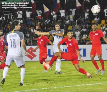  ??  ?? strike...James Younghusba­nd of the Philippine­s lets fly against singapore in the aFF championsh­ip