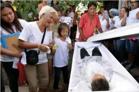  ??  ?? The funeral of five-year-old Francis Mañosca, who died with his father, Domingo, during an attack by unidentifi­ed gunmen. Photograph: Ezra Acayan/Reuters