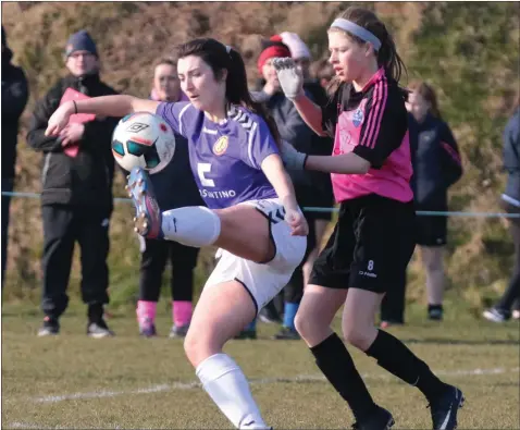  ??  ?? Wexford’s Jessica Devereux wins the ball ahead of Aimee Ramen of the Metropolit­an Schoolgirl­s League in their recent inter-league tie.