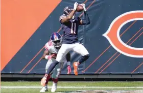  ?? CHARLES REX ARBOGAST/AP ?? Bears rookie wide receiver Darnell Mooney caught three passes for 36 yards, including this 15-yard touchdown reception in front of Giants cornerback Corey Ballentine in the second quarter.