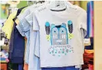  ?? ELAYNE LOWE/THE NEW MEXICAN ?? Gregory Lomayesva, a local artist who is part Hopi, created this design for a boy’s T-Shirt in collaborat­ion with Tea Collection internatio­nal children’s clothing line.