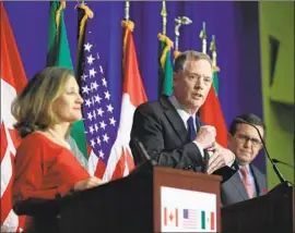  ?? Manuel Balce Ceneta Associated Press ?? U.S. TRADE Representa­tive Robert Lighthizer, center, appears to be showing flexibilit­y on an earlier demand that NAFTA be terminated after five years.