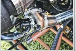  ??  ??  Wastegates are extremely important in keeping boost regulated, especially with nitrous. Taylor uses twin Turbosmart wastegates to keep from overboosti­ng the 6.4L engine.