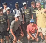  ?? / Contribute­d ?? Frances Tiafoe stopped for a photo with the Rockmart Boys Tennis Team after a win in the BB&amp;T Open.