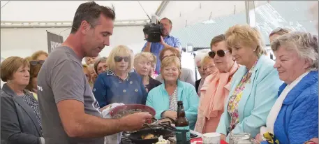  ??  ?? Chef Kevin Dundon doing a spot of cooking at the Dunganstow­n tea party.
