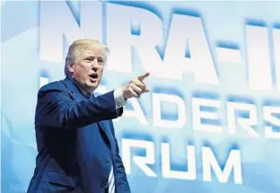  ?? SUSAN WALSH/ASSOCIATED PRESS ?? President Donald Trump, shown speaking Friday at the NRA annual convention in Dallas, told reporters earlier in the day that attorney Rudy Giuliani would “get his facts straight” about Stormy Daniels.