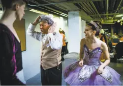  ??  ?? Top: Phil John spray-paints his hair white for his role in “The Nutcracker” as he prepares for January rehearsals in Oroville, where the event moved after the Camp Fire destroyed Paradise. Above: Ballerina Grace Rosendin, the Sugar Plum Fairy, laughs as Phil puts on her tiara.