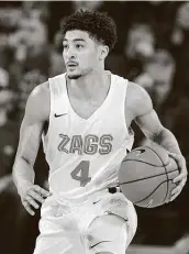  ?? Young Kwak / Associated Press ?? Ryan Woolridge leads Gonzaga in assists (4.4 per game) and is one of its six double-figure scorers.