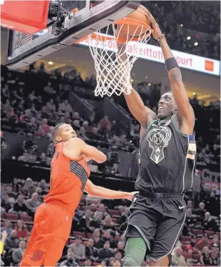  ?? AP FILE ?? Former Lobo and current Milwaukee Buck Tony Snell, right, came from tough neighborho­ods in LA but made it to the NBA thanks to his family and teammates.