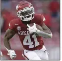  ?? (NWA Democrat-Gazette/Charlie Kaijo) ?? T.J. Hammonds had a 51-yard reception late in the third quarter and a 29-yard run early in the fourth to help set up a field goal to give Arkansas a 24-20 lead.