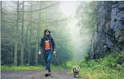  ??  ?? Tim Van Cromvoirt, left, with his Maine coon cat, Ash, on their three-day walking holiday to Snowdonia. Ash, main picture, is one of many cats being walked on leads as their owners try to give them more enrichment