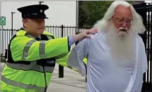  ??  ?? NO JOKE: ‘God’ is led away by a garda in the offending sketch, on rape charges