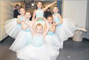  ?? NIKKI SULLIVAN/CAPE BRETON POST ?? A group of dancers from D & R Dance Ltd. show off their end pose before heading to the stage to perform their small group ballet piece, Prima Ballerina in the age 7-8 category. In front, Megan Druhan, second row from left to right, Maria McLeod and...