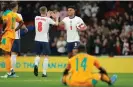  ?? ?? Watkins is congratula­ted by James Ward-Prowse after scoring against Ivory Coast last year. Photograph: Tom Jenkins/ The Guardian