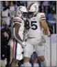  ?? CHRIS SEWARD – AP ?? Virginia's Mike Hollins, left, celebrates his touchdown with tight end Grant Misch during Saturday's game.