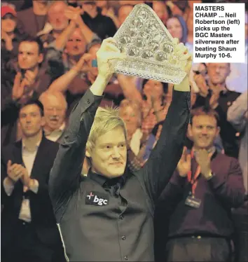  ??  ?? MASTERS CHAMP ... Neil Robertson (left) picks up the BGC Masters silverware after beating Shaun Murphy 10-6.