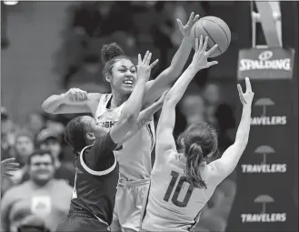  ?? STEPHEN DUNN/AP PHOTO ?? UConn’s Olivia Nelson-Ododa (20) blocks a shot by East Carolina’s Lashonda Monk (2) in the second half of Wednesday’s game at the XL Center in Hartford.