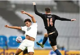  ?? — AP ?? In sync: Marseille’s Boubacar Kamara (left) and Manchester City’s Aymeric Laporte competing for the ball during the Champions League Group C match.