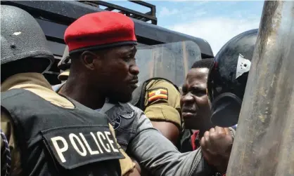  ?? Photograph: Badru Katumba/AFP/Getty Images ?? Robert Kyagulanyi, commonly known as Bobi Wine, being arrested by police on Monday.
