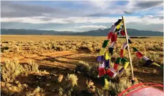  ?? SCOTT GERDES ?? Prayer flags and a labrynth are a pleasant surprise about a mile into the West Rim Trail.