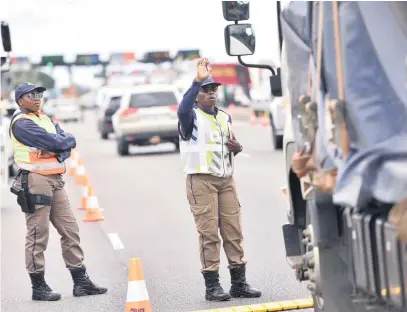  ?? Picture: Nigel Sibanda ?? STRONG ARM OF THE LAW. The Tshwane Metro Police Department launches its Easter road safety operations at N1 Carousel Toll Plaza in Pretoria yesterday. The operation is intended to reduce road fatalities by checking vehicle and driver fitness over the long weekend.
