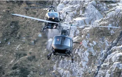  ?? PHOTO: DAVID JAMES ?? Aerial chase . . . Mission: Impossible — Fallout actors Henry Cavill (back helicopter) and Tom Cruise are filmed in a helicopter chase through the Skippers Canyon in Queenstown last year.