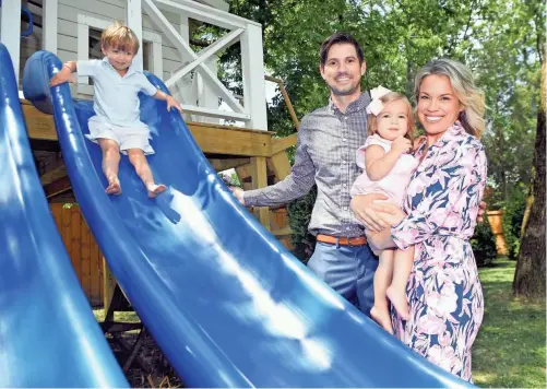  ?? SHELLEY MAYS/THE TENNESSEAN; AND GETTY IMAGES AND SUBMITTED ?? Sara Jo Walker and her husband, Ryan, play with their children, Jack, 3, and Ivy, 18 months, in their Nashville backyard Friday. Sara Jo Walker wrote a children’s book on face masks. It is No. 1 on Amazon’s “New Releases in Children’s Safety” book list. “Whether we like it or not, masks are all around us,” she said amid the viral pandemic.