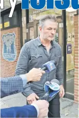 ??  ?? Baldwin exits the 6th precinct of the New York Police Department in Manhattan, New York, on Friday. — Reuters photos