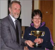  ??  ?? Olive Waters (manager) accepting the trophy from Craig Casey.