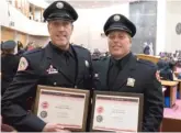  ?? RICK MAJEWSKI/FOR THE SUN-TIMES PHOTOS ?? Firefighte­rs William Monaco and James Sewnig at City Hall after receiving the Special Honorable Mention for rescuing Nina Steen from a fire.